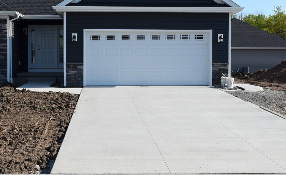 large concrete slap patio behind a home