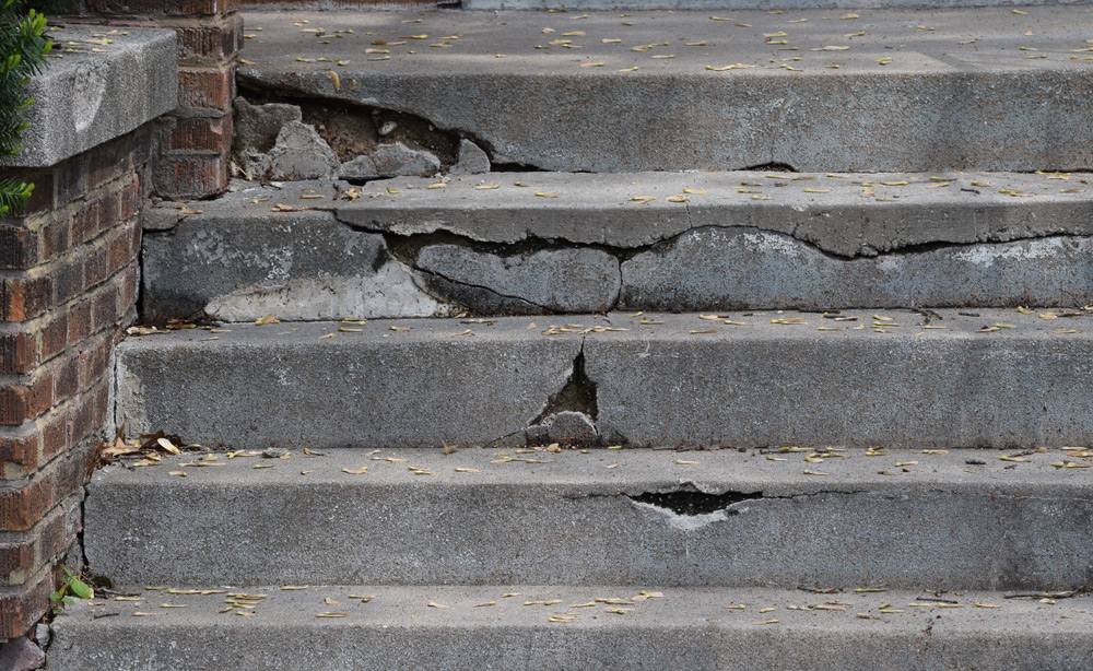 picture of concrete stairs that are cracked and crumbling
