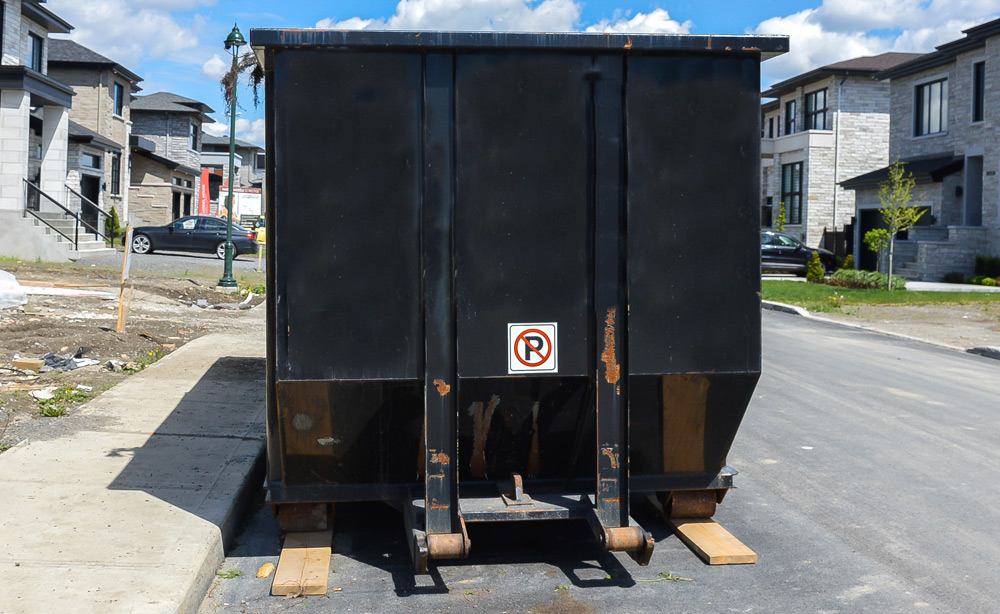 a black roll off dumpster rental