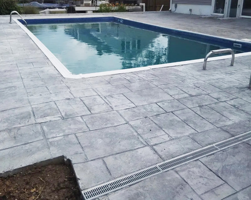 pool with stamped concrete around it
